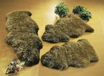 Bettumrandung aus echtem Lammfell in Tierform 